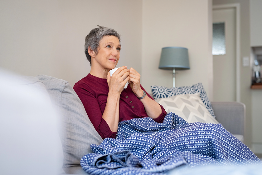 relaxed-mature-woman-enjoying-tea-sitting