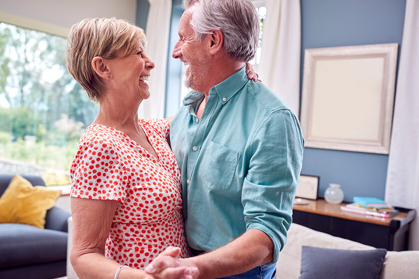 Romantic Senior Retired Couple Dancing In Lounge